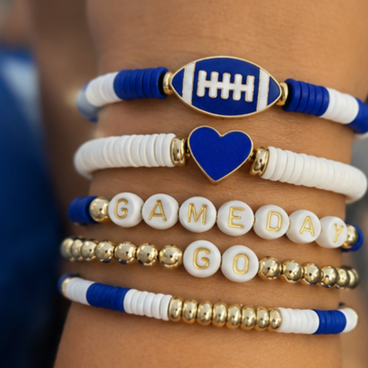 Collection of bracelets with FOOTBALL-themed designs on a wrist. CLAY BEAS WHITE AND BLUE SOBERAFSHOP